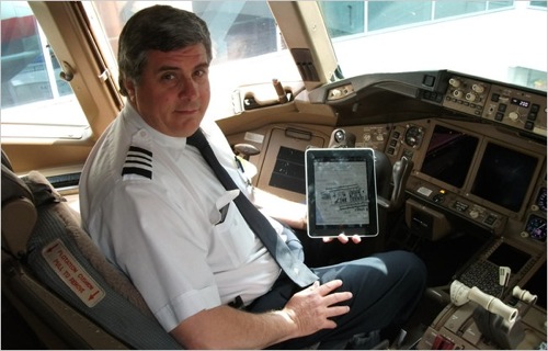 ipad-in-pilot-cabin-first-officer-kelly-caglia-of-american-airlines-with-an-ipad-in-a-boeing-777