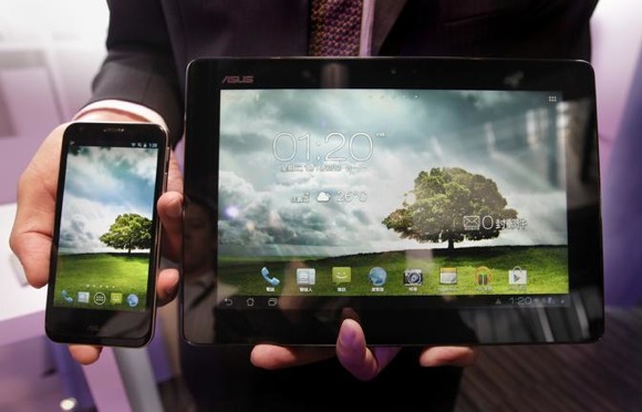 Asus’ new product Padfone 2, which combines smartphone and tablet PC functions, is presented during a media launch in Taipei